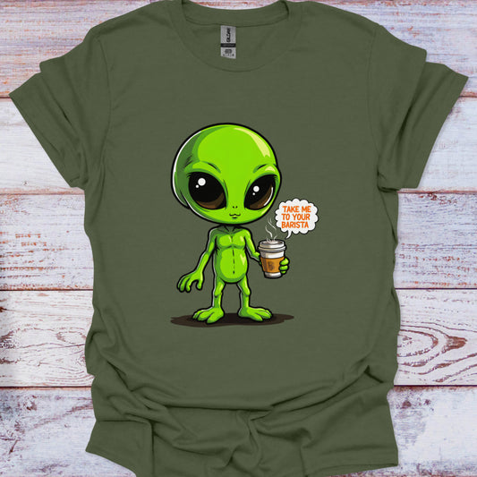 Green t-shirt with an alien holding a coffee cup design on a wooden surface