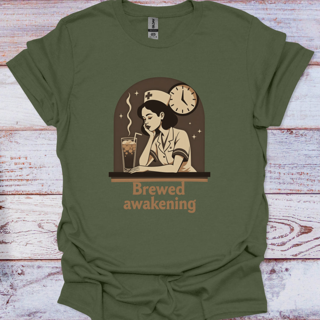 Green t-shirt with a graphic of a woman drinking coffee and text 'Brewed awakening' on a wooden surface.