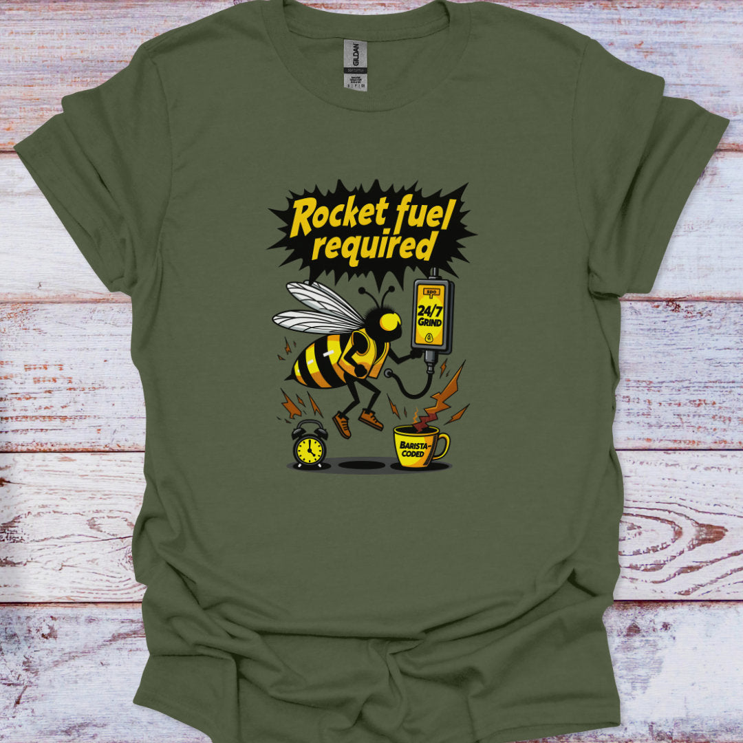 Green t-shirt with a bee graphic and text 'Rocket fuel required' on a wooden surface