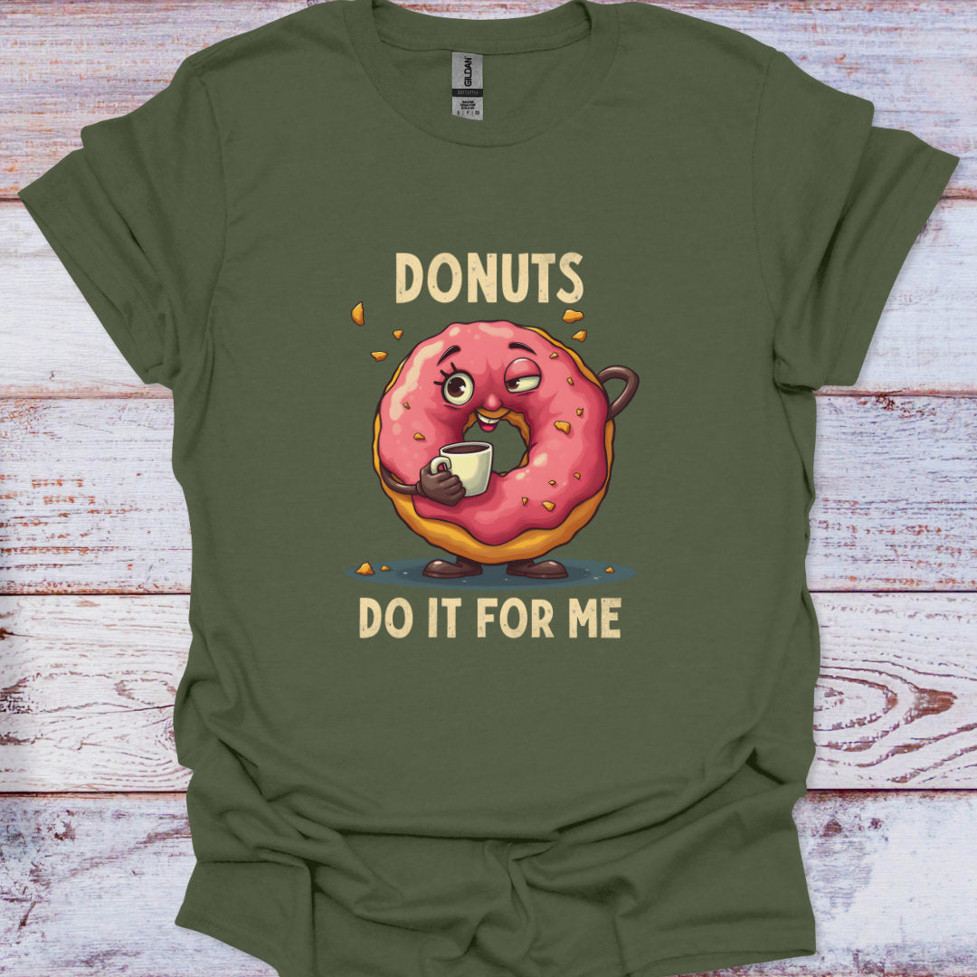 Green t-shirt with a cartoon donut holding a coffee cup and text 'DONUTS DO IT FOR ME' on a wooden surface.
