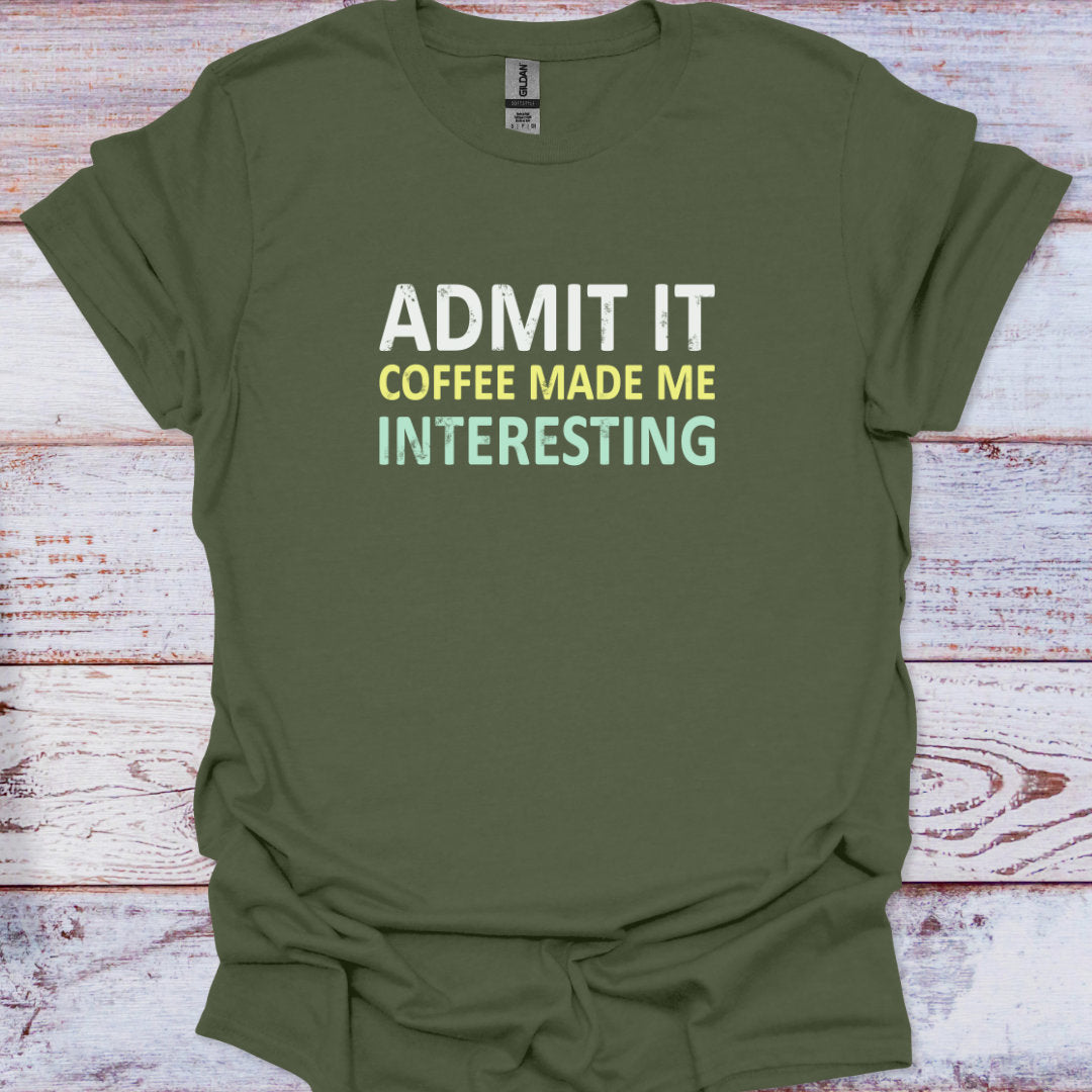 Green t-shirt with text 'ADMIT IT COFFEE MADE ME INTERESTING' on a wooden surface