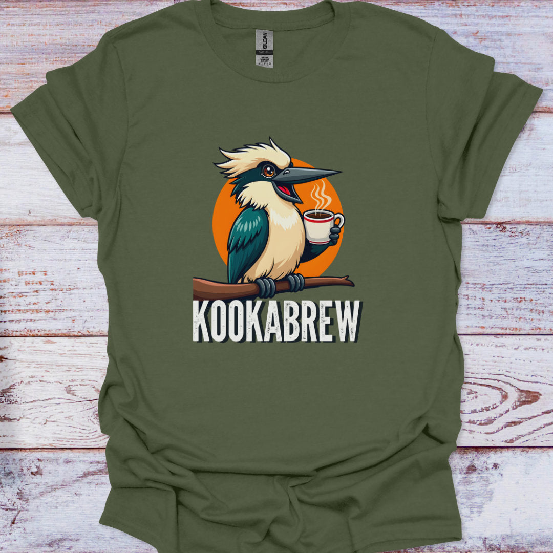 Green t-shirt with a kookaburra design holding a coffee cup and the text 'KOOKABREW' on a wooden surface.