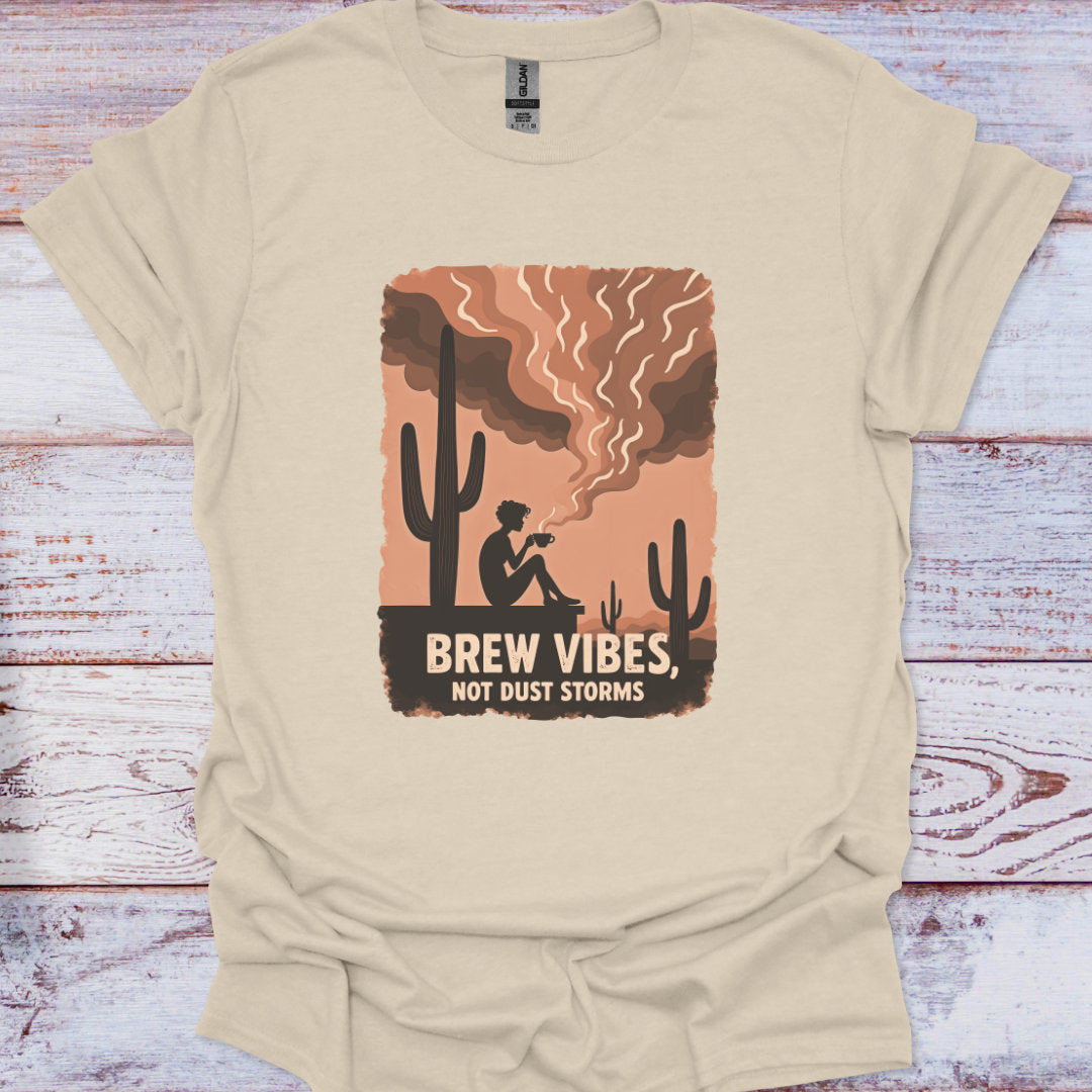 Beige t-shirt with a graphic design of a cactus and text on a wooden surface
