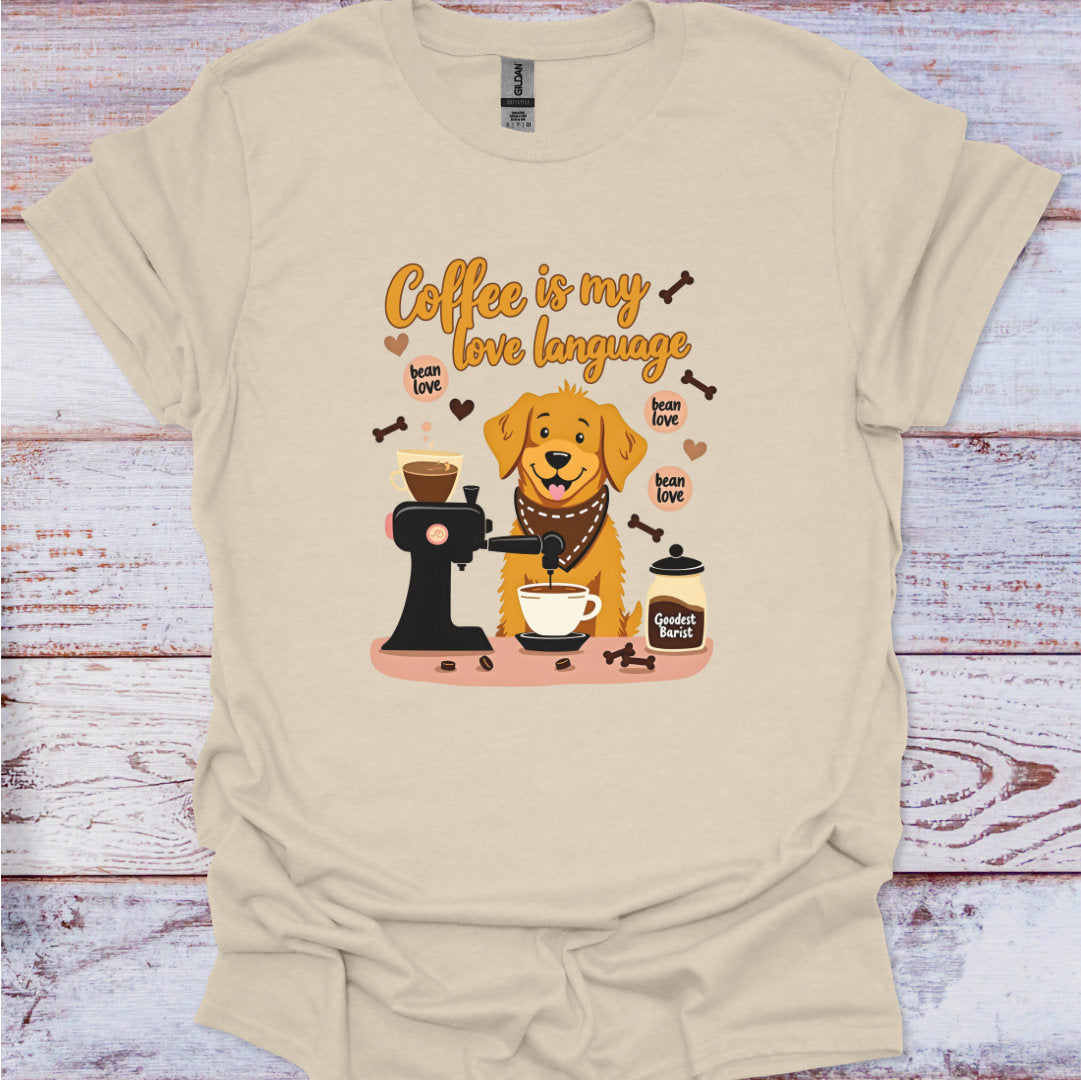 Beige t-shirt with a dog and coffee-themed graphic on a wooden surface