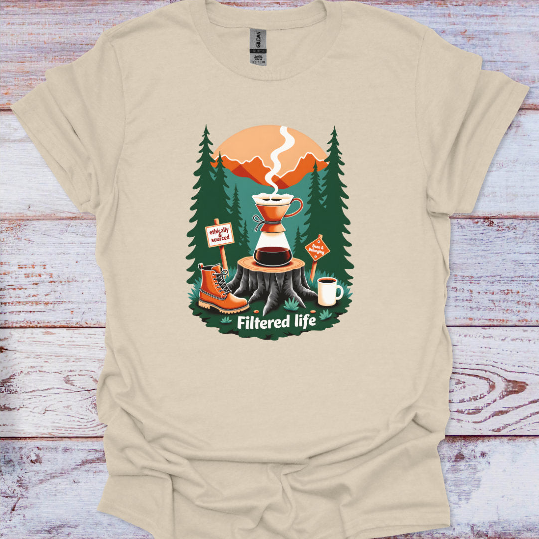Beige t-shirt with a coffee-themed graphic on a wooden surface