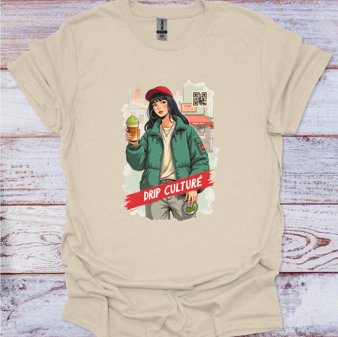 Beige t-shirt with a graphic of a young female holding a drink and text 'Drip Culture' on a wooden surface.