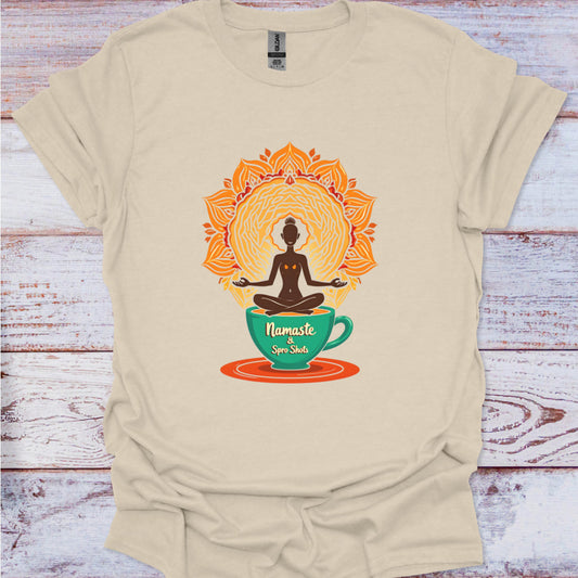 Beige t-shirt with a 'Namaste' cup design on a wooden surface