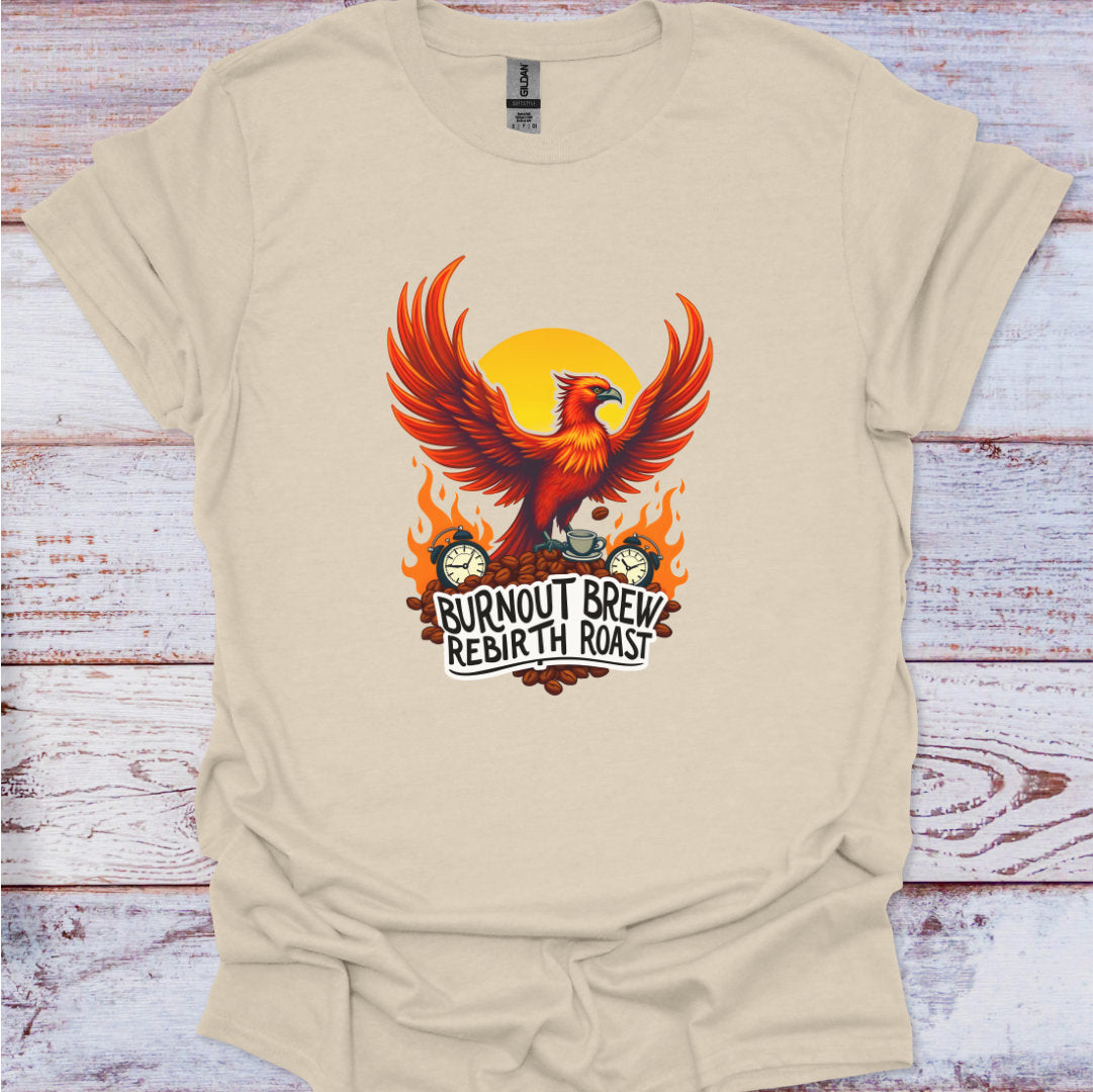 Beige t-shirt with a phoenix design and 'Burnout Brew Rebirth Roast' text on a wooden surface.
