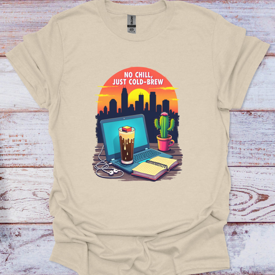 Beige t-shirt with a graphic design of a laptop, coffee, and cactus on a wooden surface