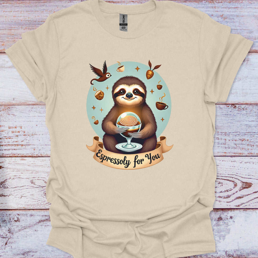 Beige t-shirt with a sloth holding a coffee cup design on a wooden surface