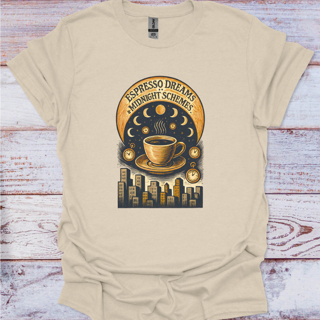 Beige t-shirt with a coffee cup graphic and text 'Espresso Dreams & Midnight Schemes' on a wooden surface.
