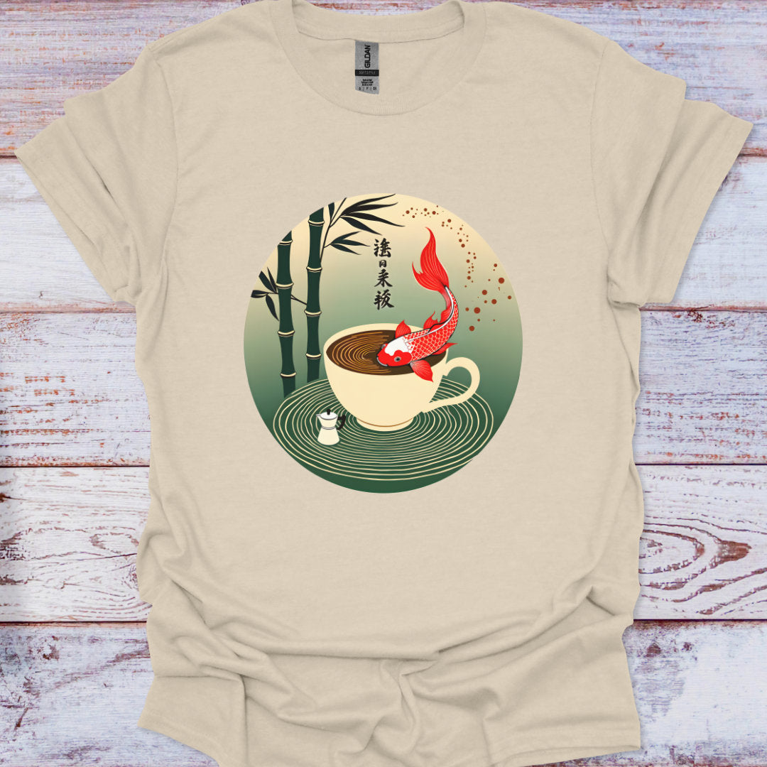 Beige t-shirt with a cup and koi fish design on a wooden surface
