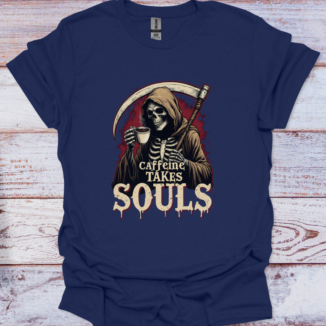 Navy blue t-shirt with a graphic of a skeleton holding a coffee cup and text 'Caffeine Takes Souls' on a wooden surface.