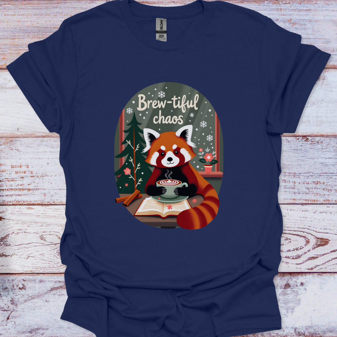 Navy blue t-shirt with a red panda holding a cup of coffee and 'Brew-tiful chaos' text on a wooden background