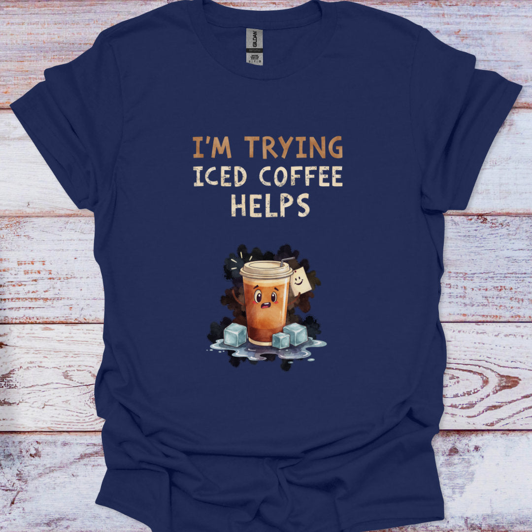 Navy blue t-shirt with iced coffee graphic and text on a wooden surface