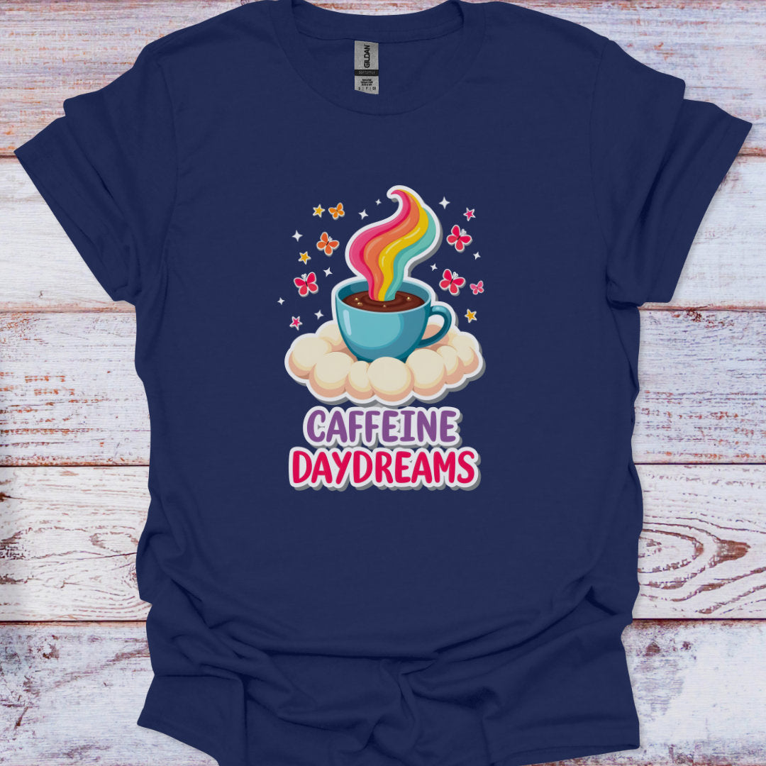 Navy blue t-shirt with a colorful coffee cup graphic and 'Caffeine Daydreams' text on a wooden surface.