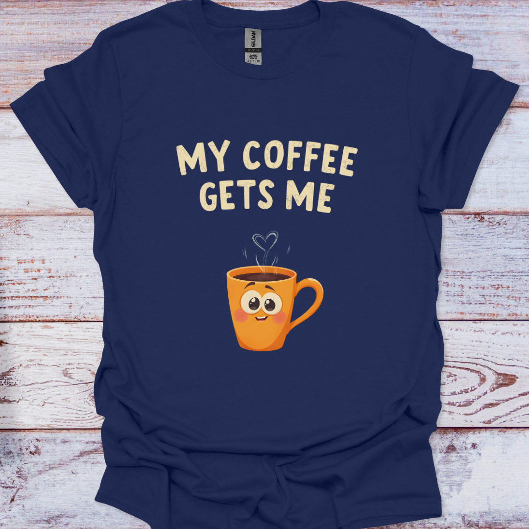 Navy blue t-shirt with a cartoon coffee mug and 'My Coffee Gets Me' text on a wooden surface