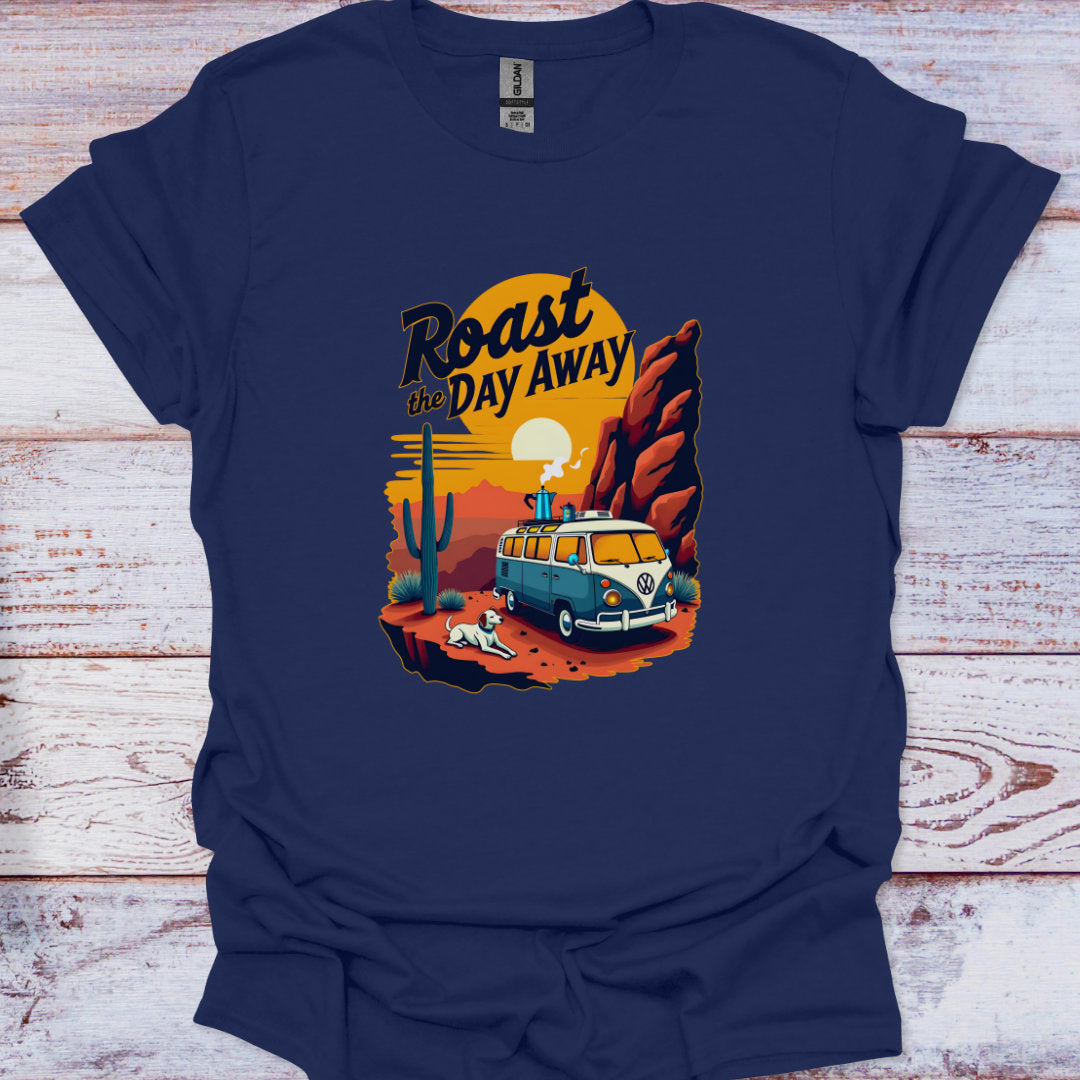 Navy blue t-shirt with a graphic design of a van and desert scene on a wooden surface