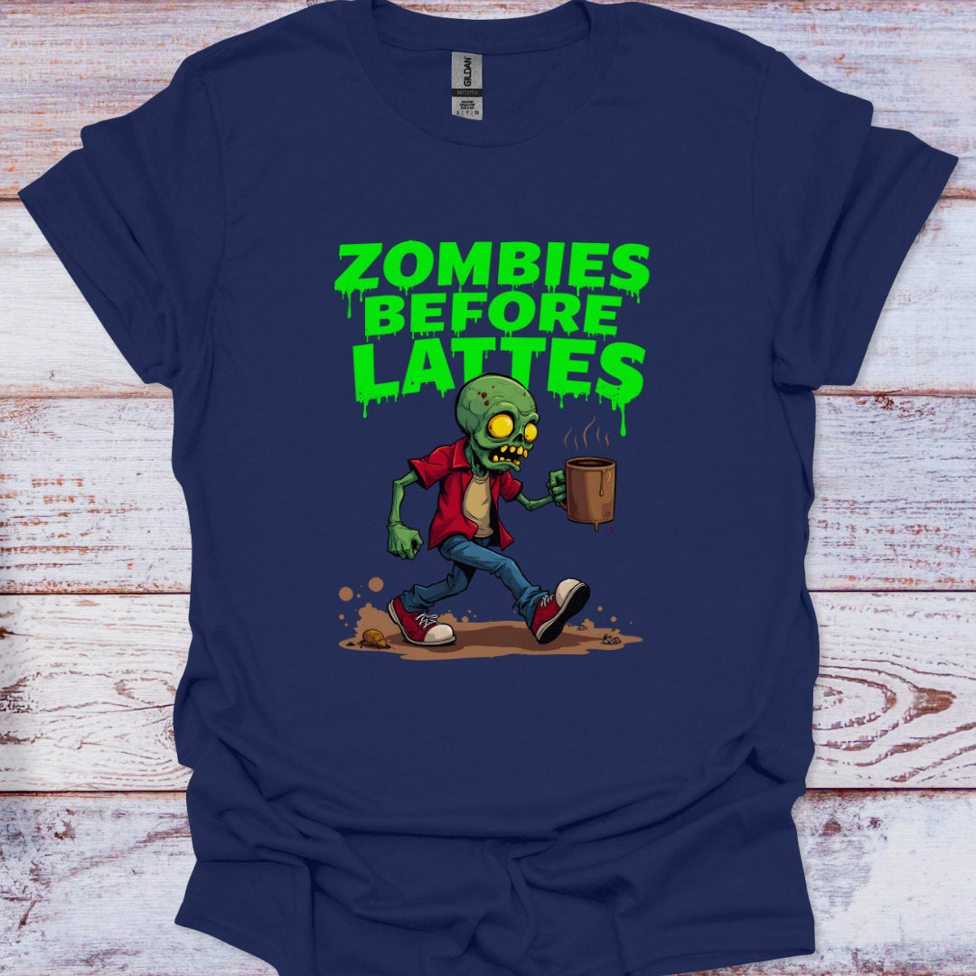 Navy blue t-shirt with a zombie graphic and 'Zombies Before Lattes' text on a wooden surface.