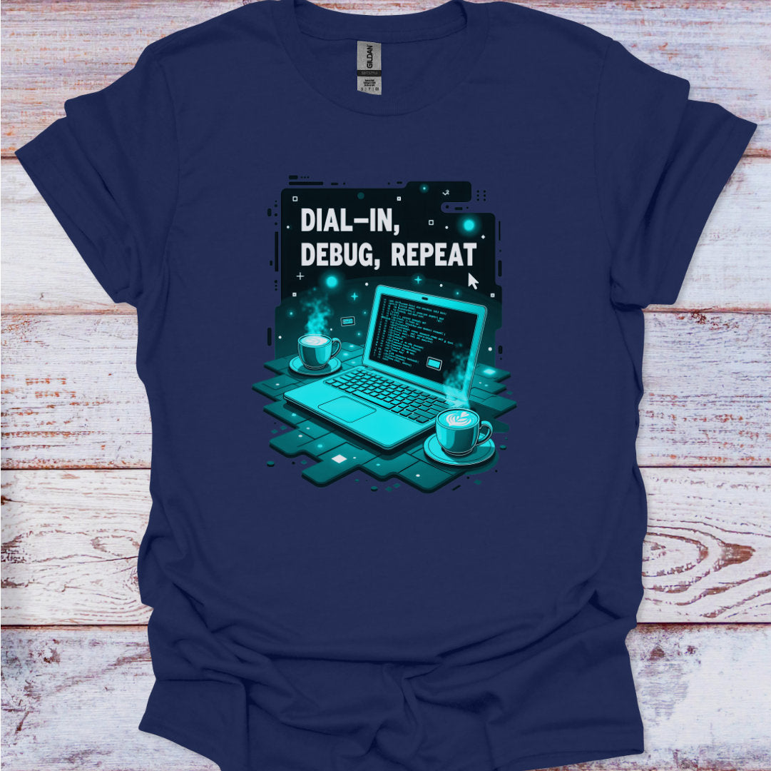 Navy blue t-shirt with a graphic of a laptop and text 'Dial-In, Debug, Repeat' on a wooden surface.