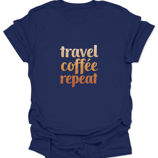 A navy blue t-shirt with the "travel coffee repeat" graphic, where the orange and beige text creates a high-contrast pop against the cool blue background.