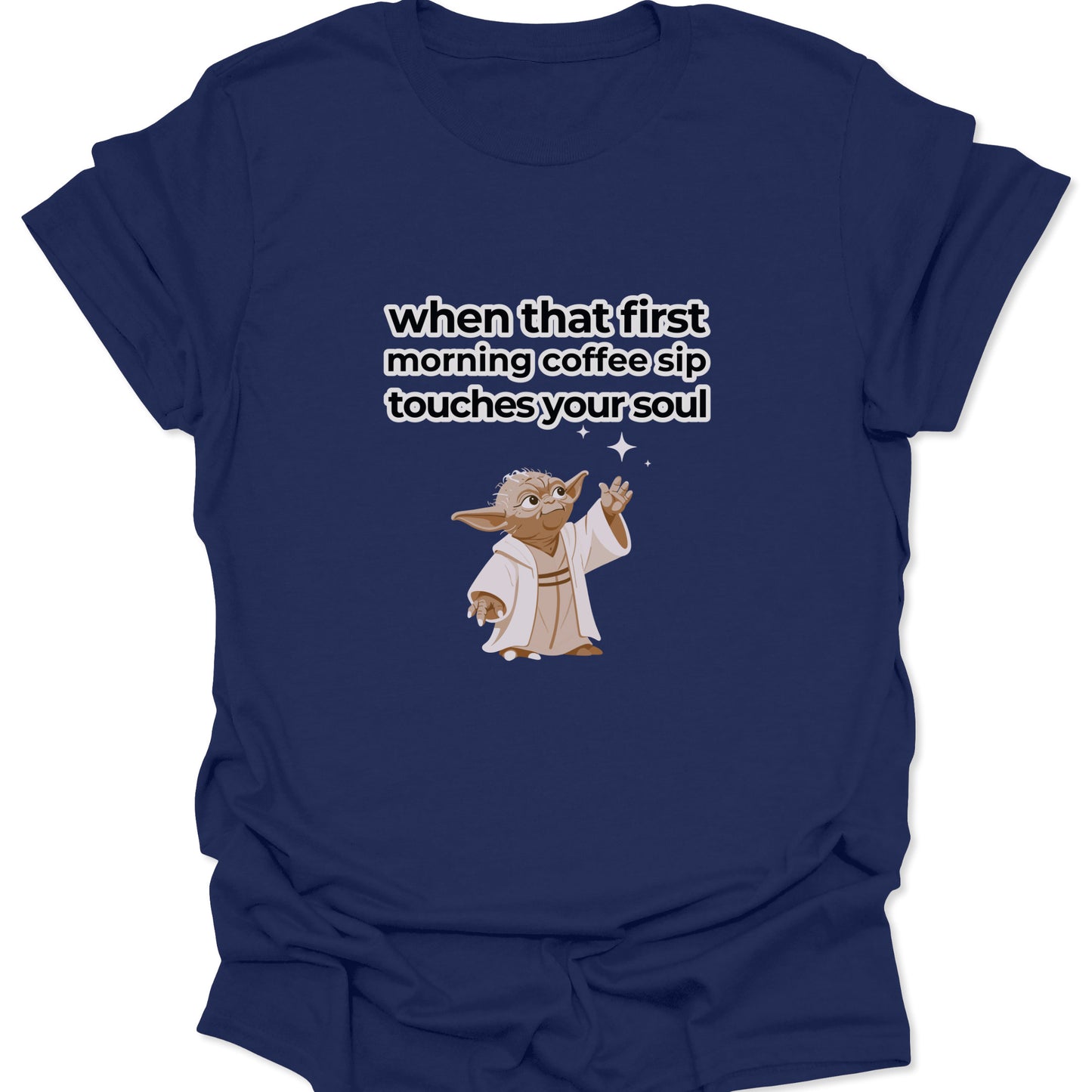 A navy blue t-shirt with a high-contrast white text design and a small Yoda character illustration celebrating the first sip of coffee.