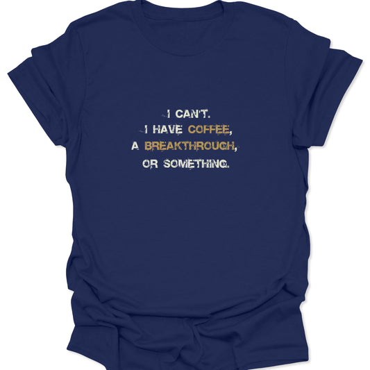 A navy blue t-shirt with a witty text design. The white typewriter font pops against the dark blue, while the gold accent words add a subtle contrast suitable for a casual office look