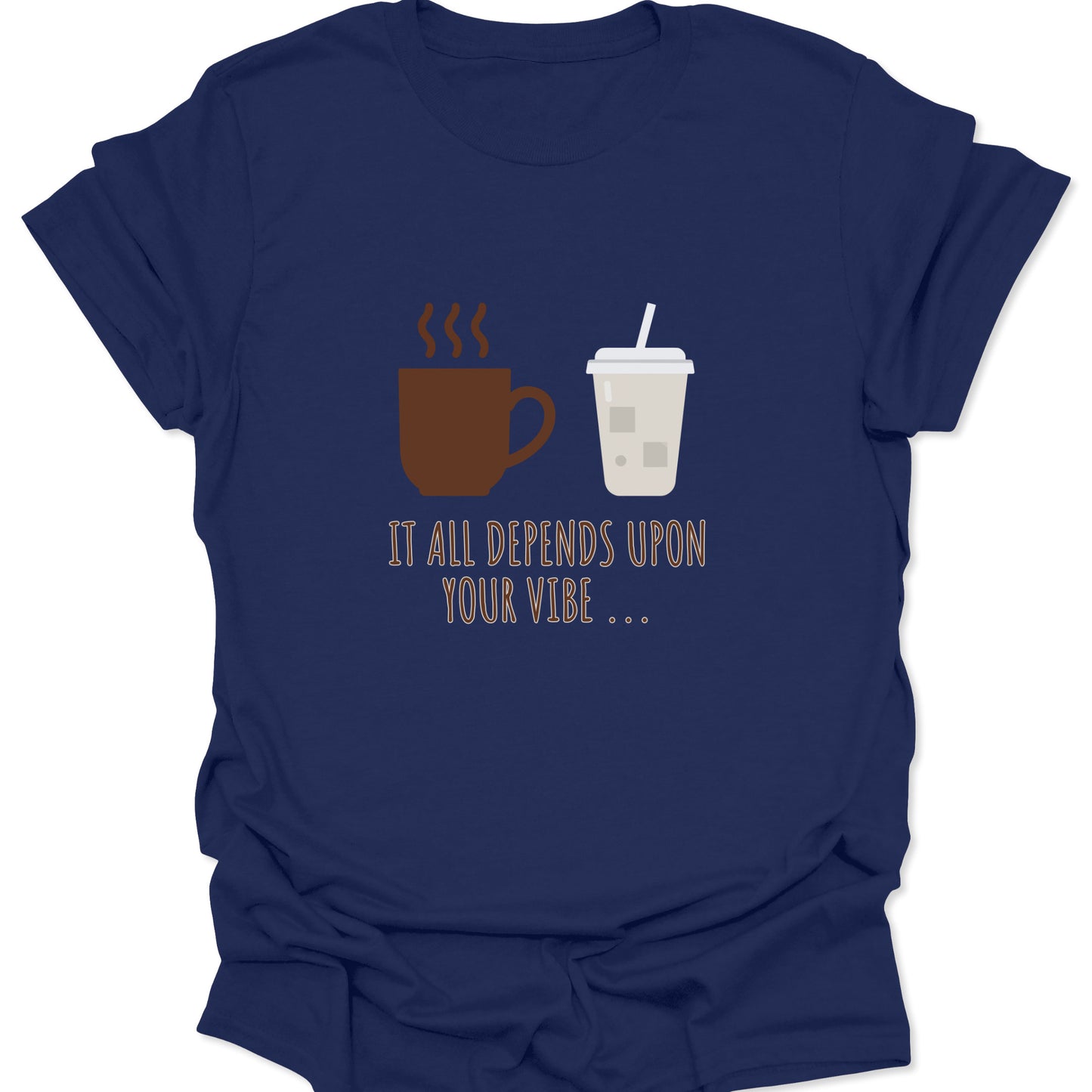 Graphic tee on navy blue fabric featuring a brown steaming coffee mug and a light beige iced coffee cup with the text "IT ALL DEPENDS UPON YOUR VIBE..." in thin brown lettering.