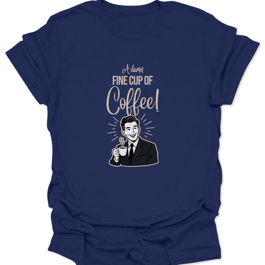 A navy blue t-shirt featuring a classic 1950s-style coffee advertisement graphic with a man in business attire and a steaming mug in a distressed cream print.