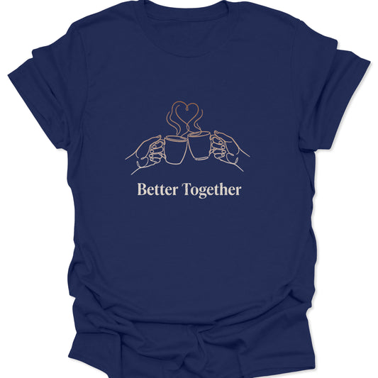 Graphic tee featuring tan line art of two coffee mugs clinking with heart-shaped steam and "Better Together" text on a navy blue background.