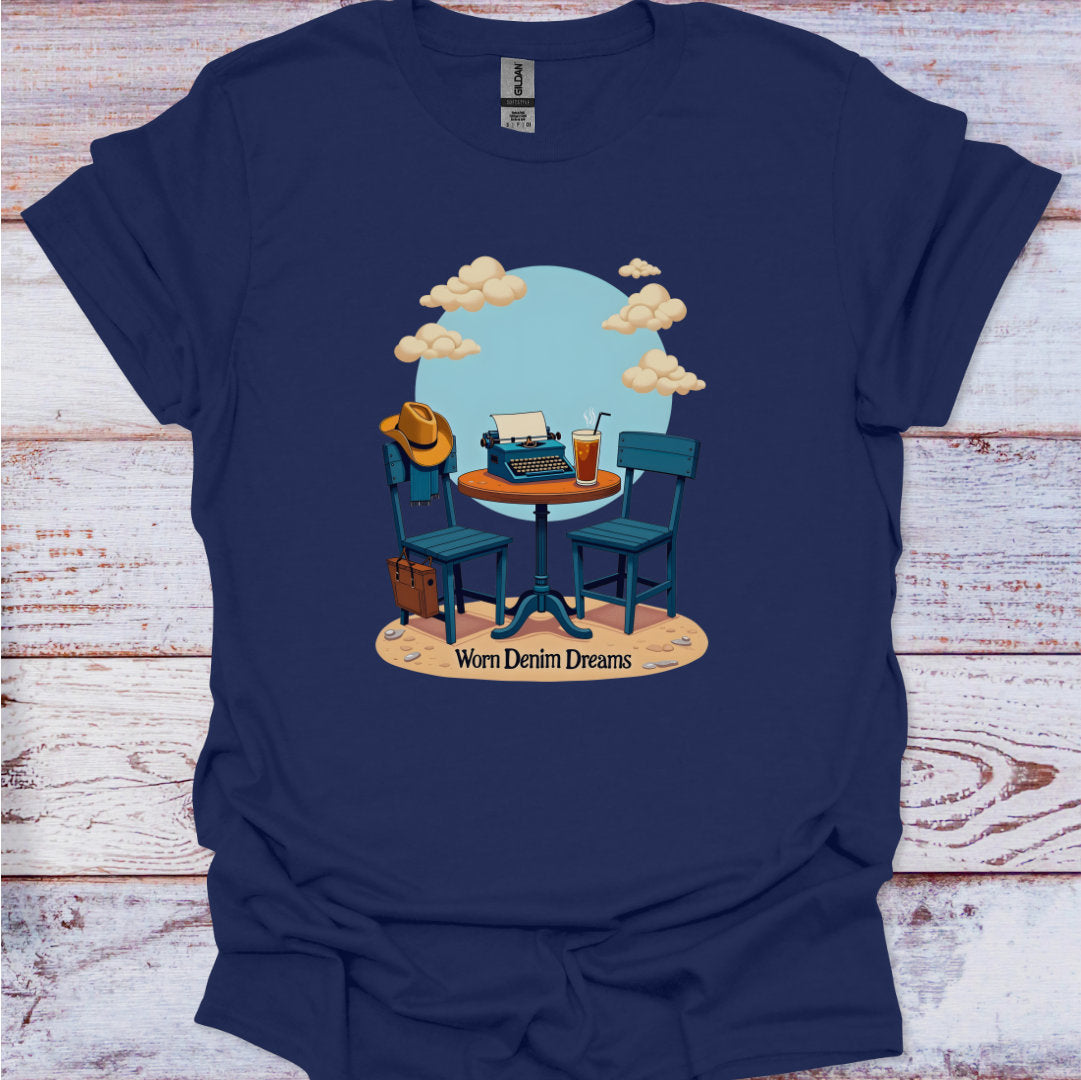 Navy blue t-shirt with a graphic of a typewriter, cowboy hat, and chairs on a wooden surface.