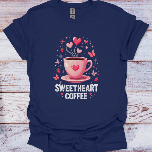 Navy blue t-shirt with a pink coffee cup graphic and 'Sweetheart Coffee' text on a wooden surface.