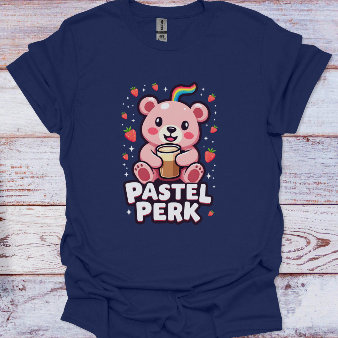 Navy blue t-shirt with a cartoon bear and 'Pastel Perk' text on a wooden surface