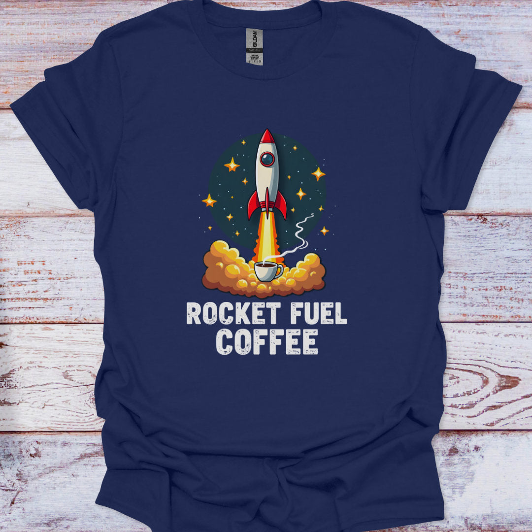 Navy blue t-shirt with a graphic of a rocket and 'Rocket Fuel Coffee' text on a wooden surface.
