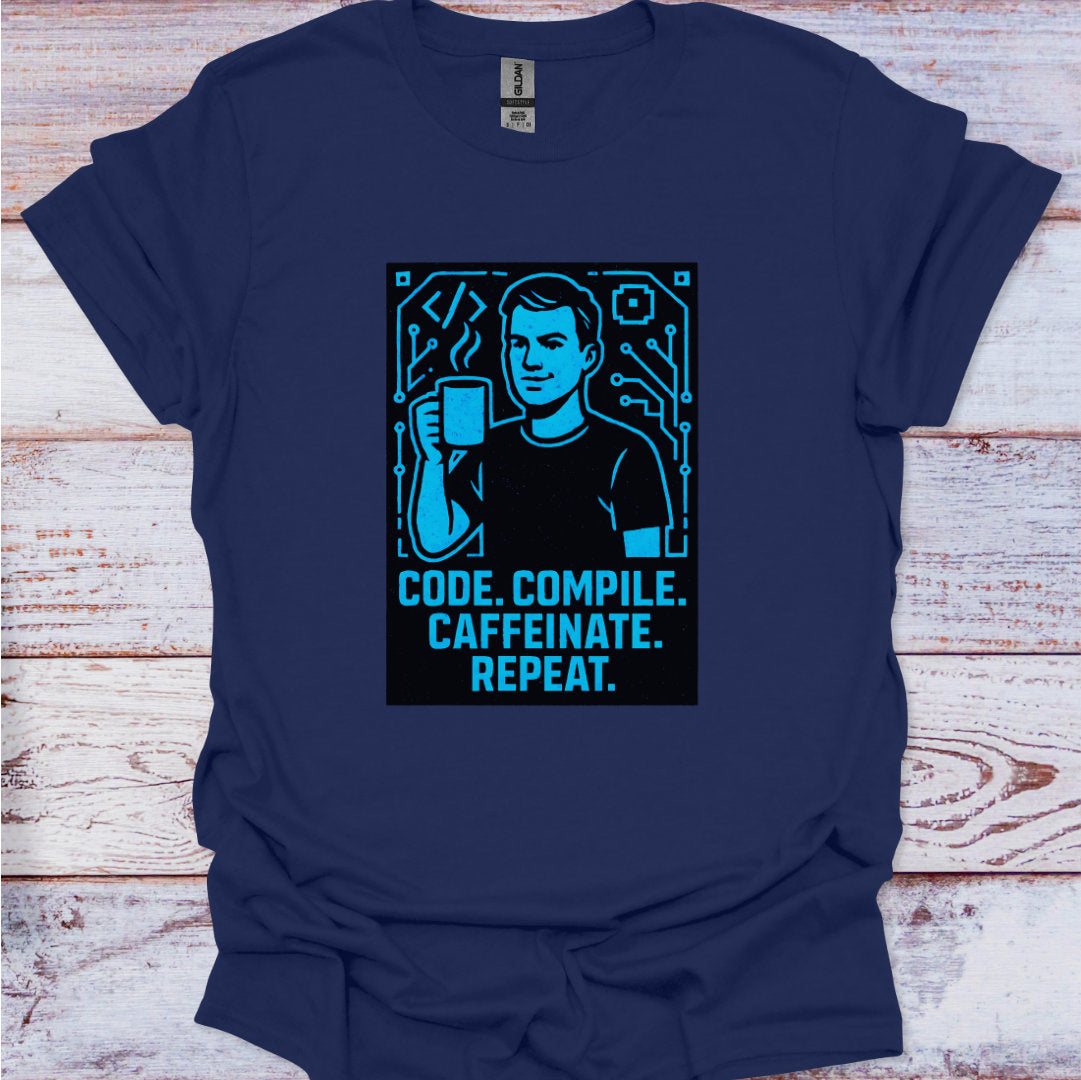 Navy blue t-shirt with a graphic and text 'Code. Compile. Caffeinate. Repeat.' on a wooden surface.