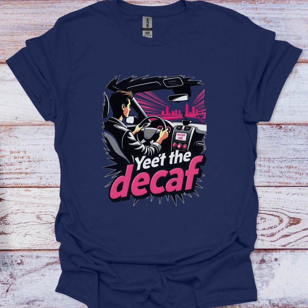 Navy blue t-shirt with a graphic design of a person driving a car and text 'Yeet the decaf' on a wooden surface.