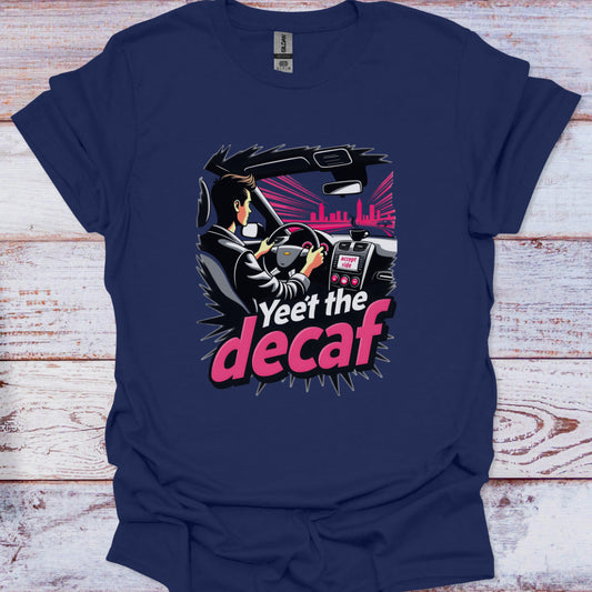 Navy blue t-shirt with a graphic design of a person driving a car and text 'Yeet the decaf' on a wooden surface.