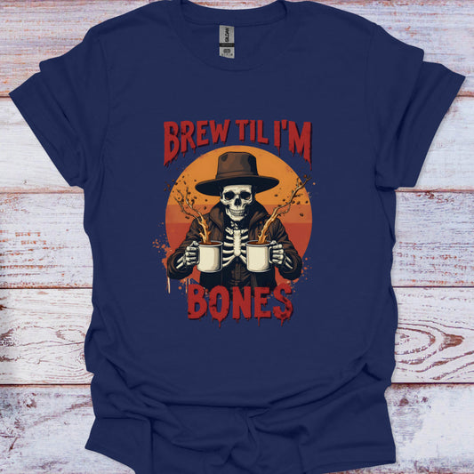 Navy blue t-shirt with a skeleton holding beer mugs and text 'Brew Til I'm Bones' on a wooden surface.