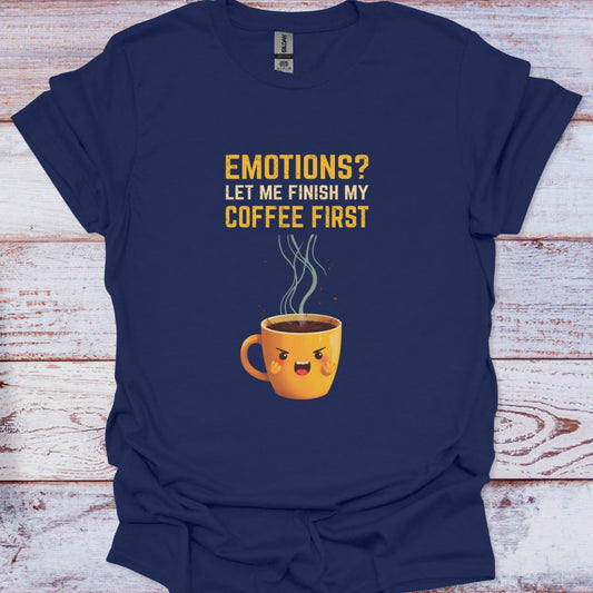 Navy blue t-shirt with a coffee cup graphic and text on a wooden surface