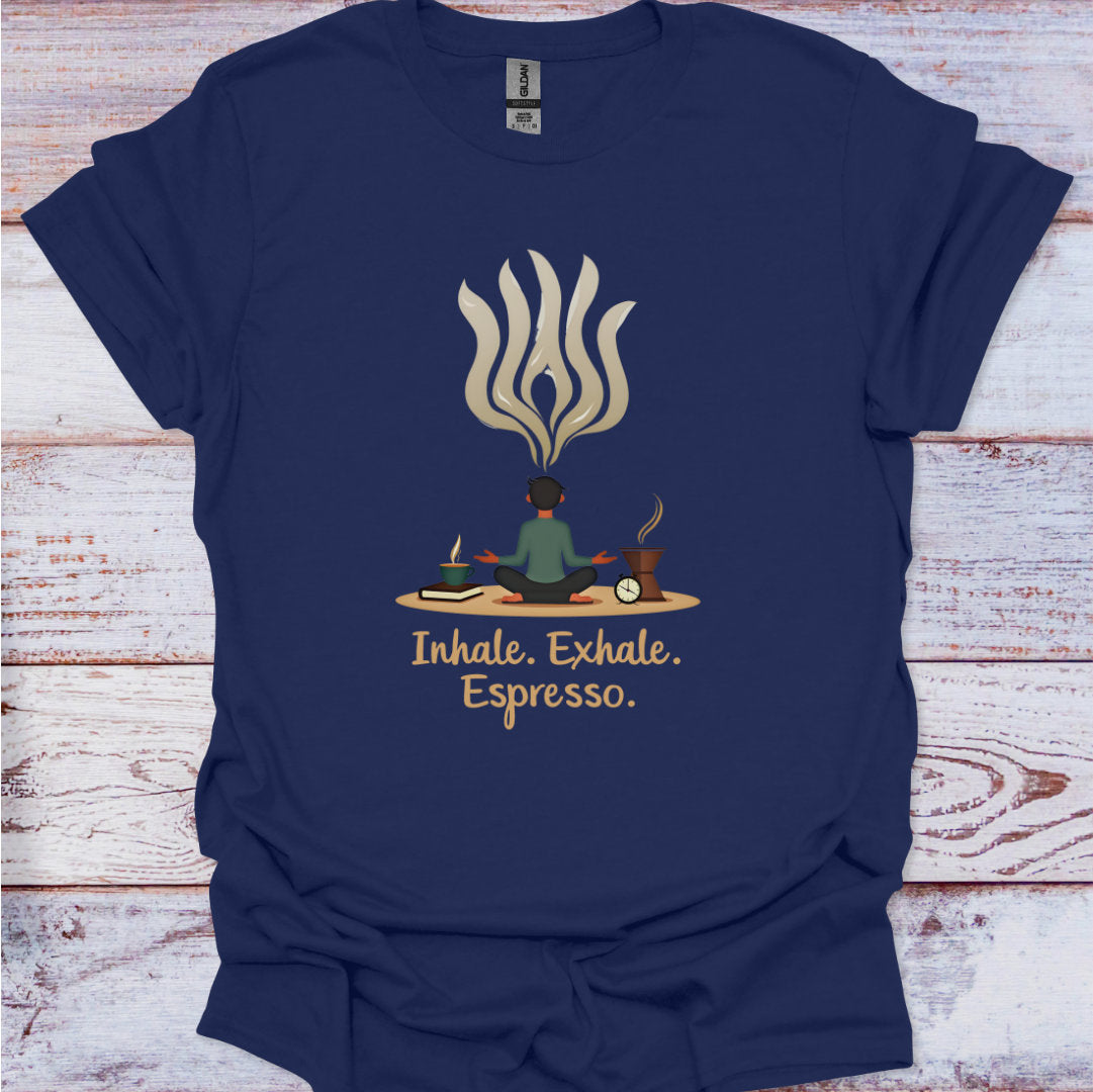 Navy blue t-shirt with a graphic of a person meditating and flames, text 'Inhale. Exhale. Espresso.' on a wooden surface.