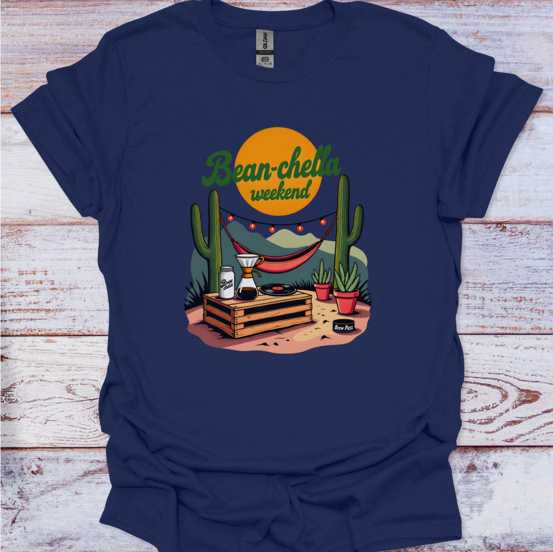 Navy blue t-shirt with a graphic design featuring cacti, a beer can, and a coffee cup on a wooden background.