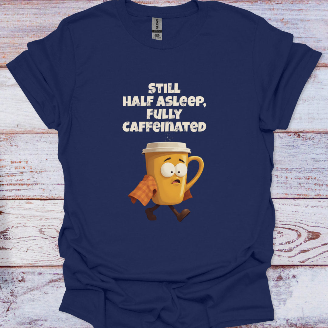 Navy blue t-shirt with a cartoon coffee mug and text on a wooden surface