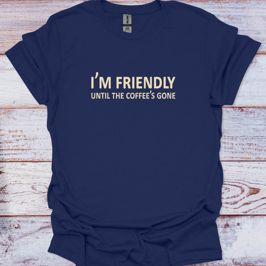 Navy blue t-shirt with white text on a wooden surface