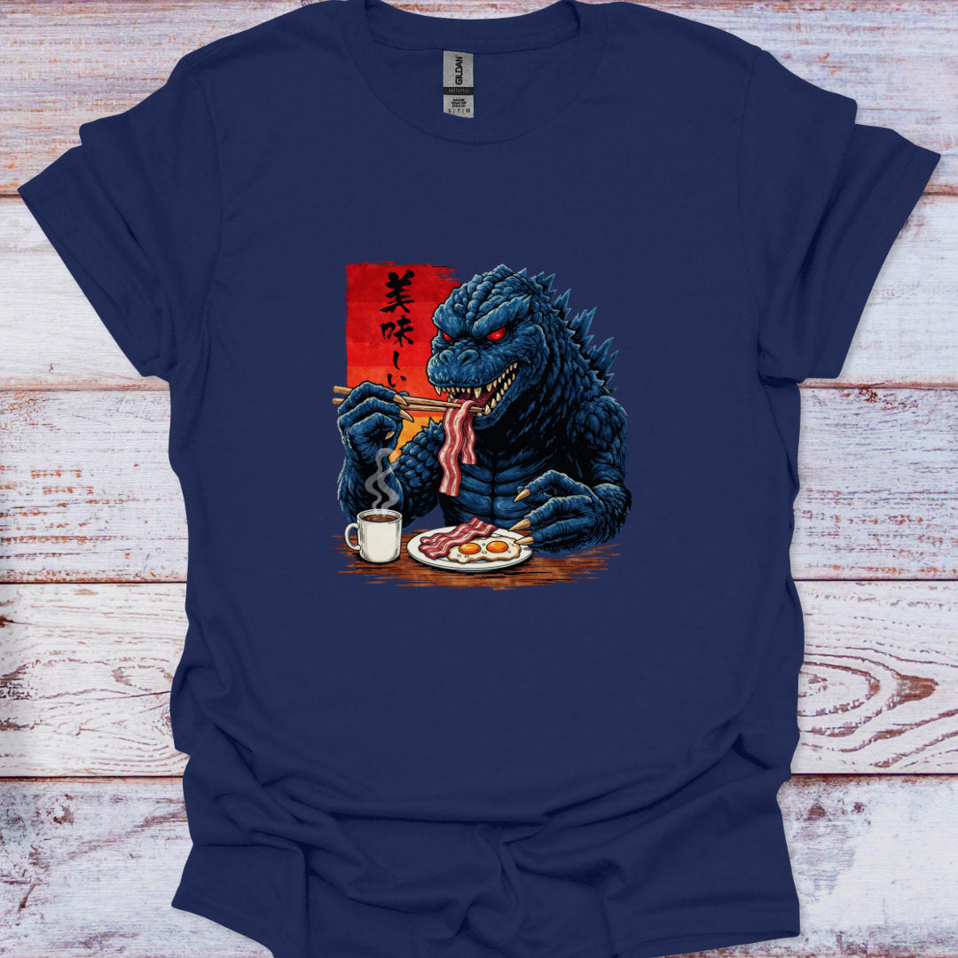 Navy blue t-shirt with a dragon kaiju eating breakfast graphic on a wooden surface