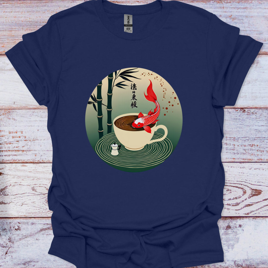 Navy blue t-shirt with a cup and koi fish design on a wooden surface