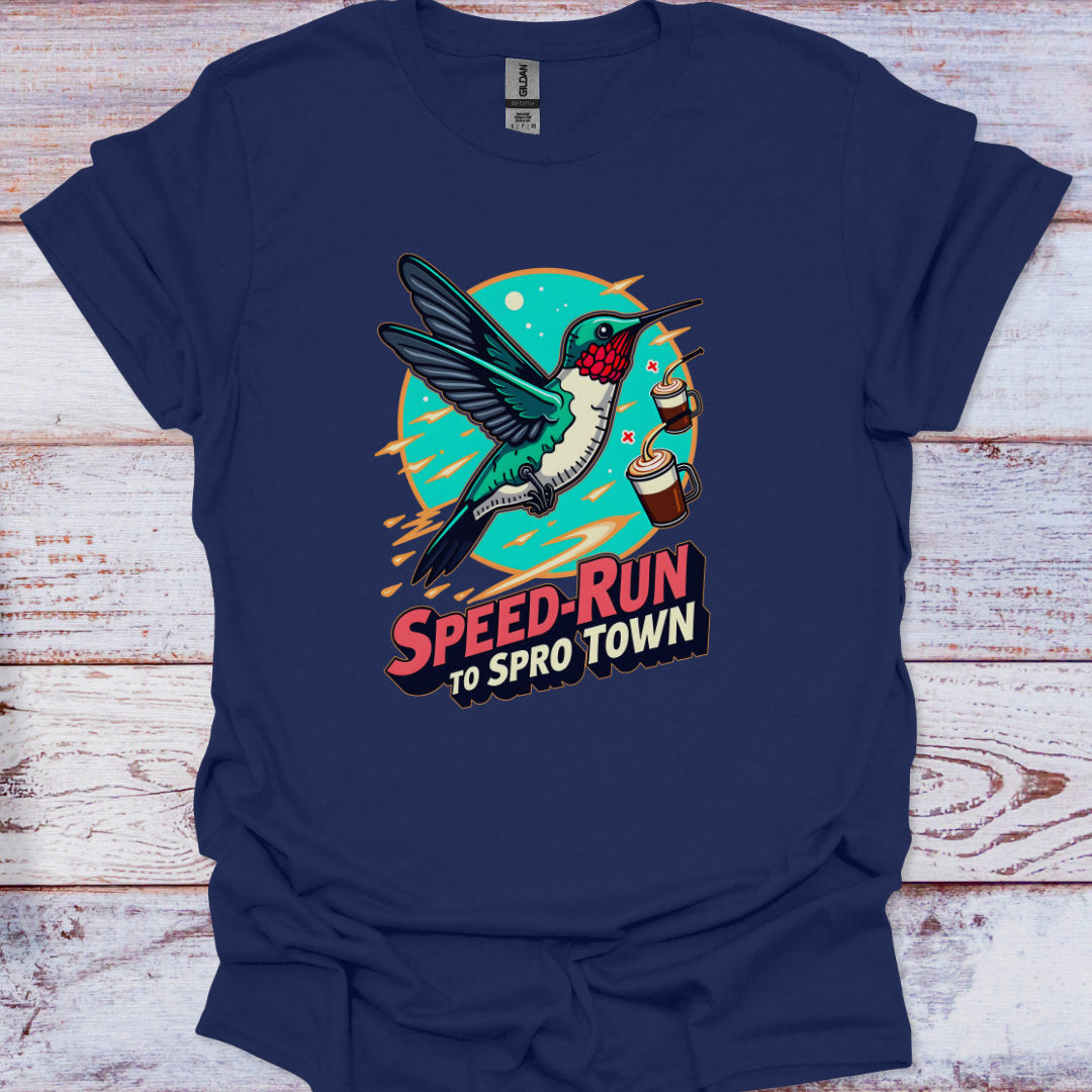 Navy blue t-shirt with a colorful graphic of a hummingbird and text on a wooden surface