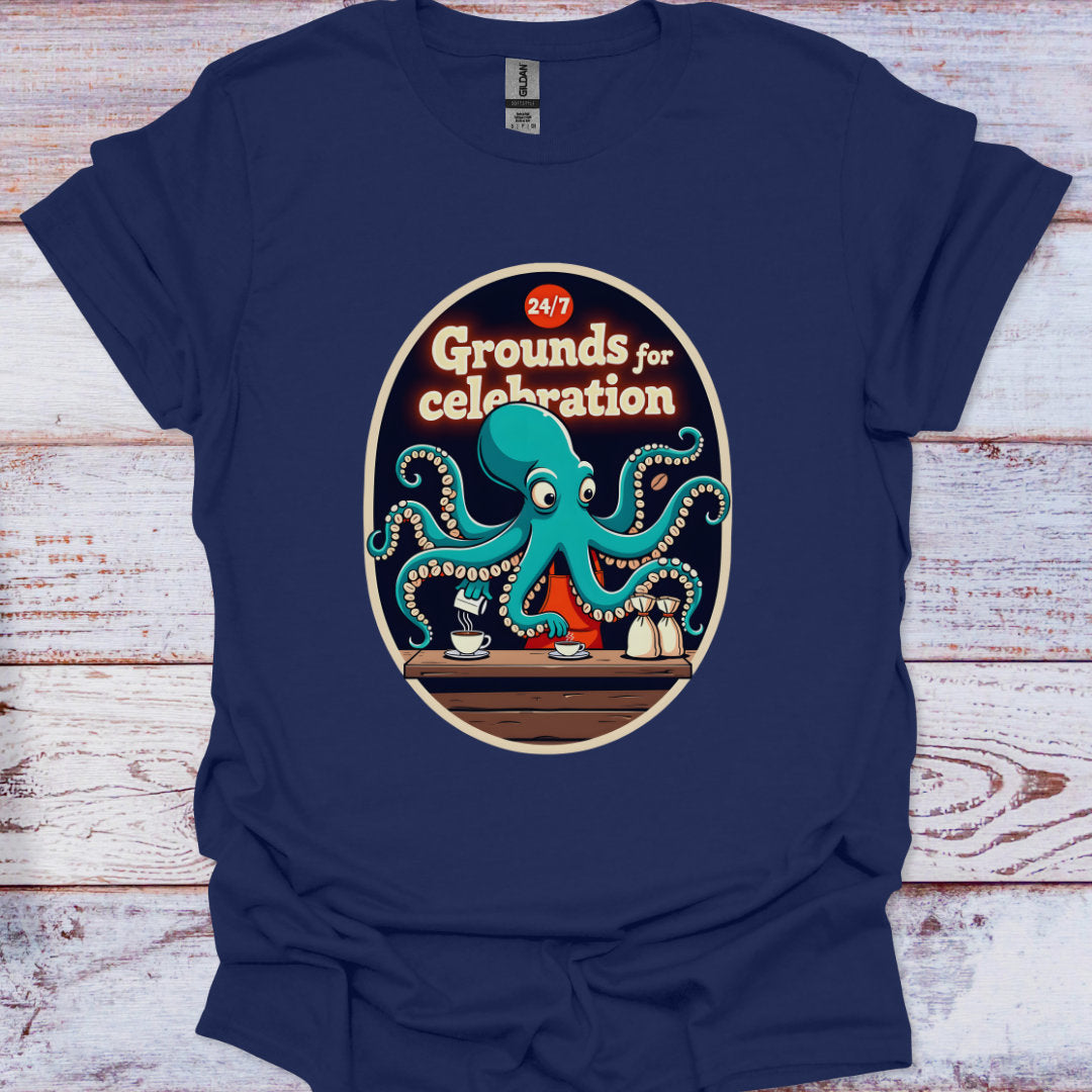 Navy blue t-shirt with a graphic of an octopus and text '24/7 Grounds for celebration' on a wooden surface.