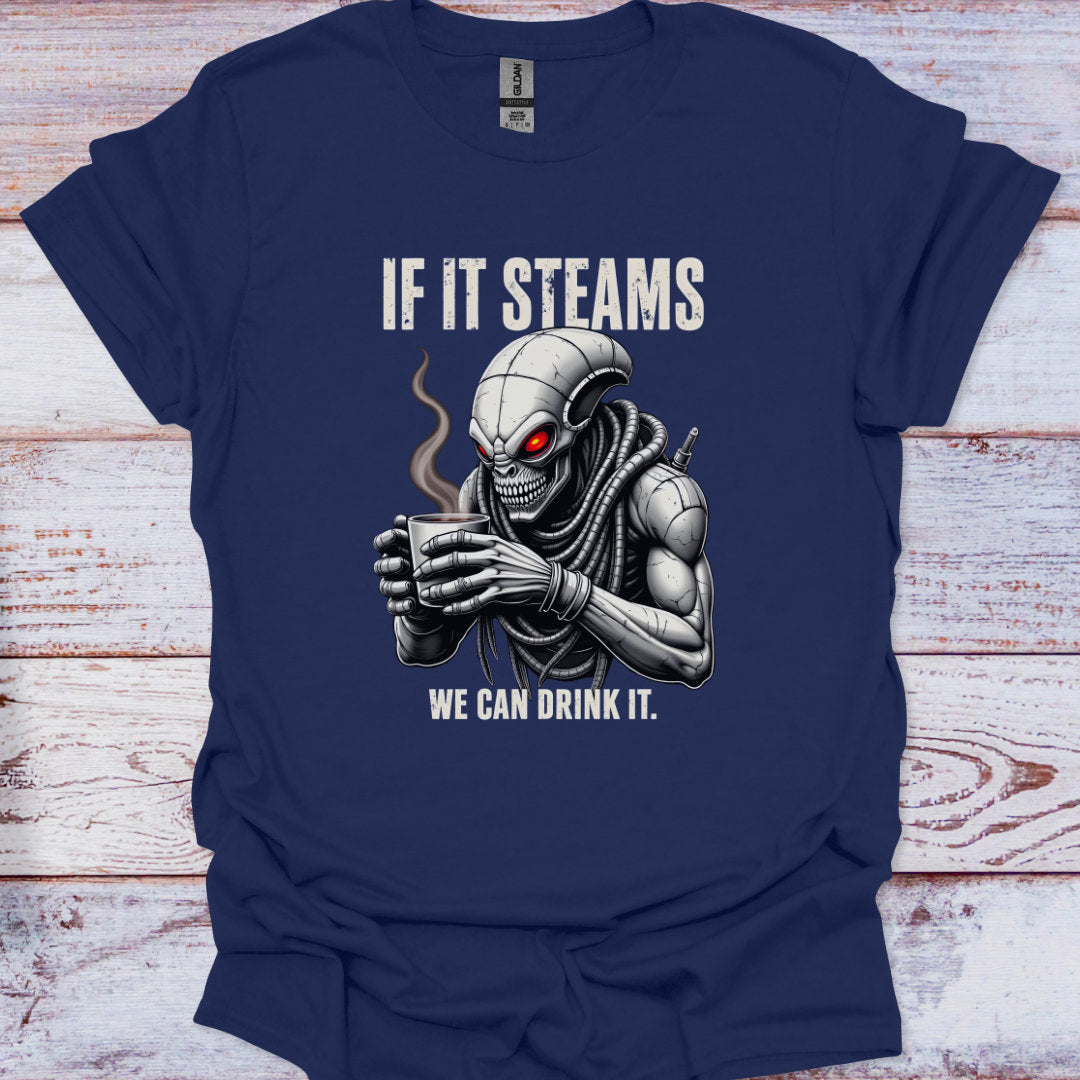 Navy blue t-shirt with a graphic of a robot drinking coffee and text 'If it steams we can drink it' on a wooden surface.