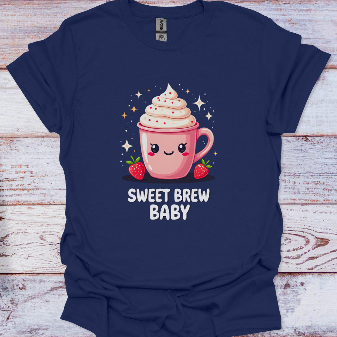 Navy blue t-shirt with a pink coffee cup graphic and 'Sweet Brew Baby' text on a wooden surface.