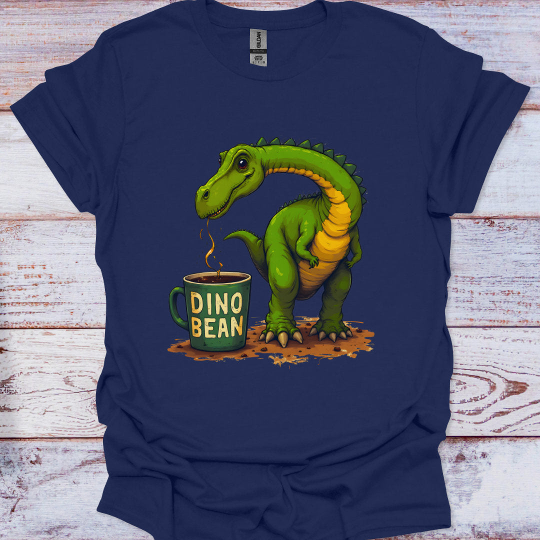 Navy blue t-shirt with a green dinosaur and 'Dino Bean' mug design on a wooden surface.